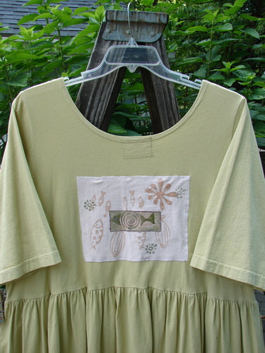 Barclay PMU Patched Flower Garden Dress Citron Size 1 featuring a scooped neckline, drop straight waist seam, front pocket, and decorative fish patches.