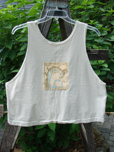1999 PMU Patched Tank Top Wave Natural Size 1 - A white organic cotton tank top with a colorful wave patch and Blue Fish logo, featuring a wide, boxy shape and scooped neckline.