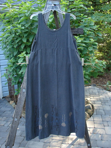 2000 Tencel Shift Dress Biology Abstract Twilight Size 0 displayed draped on a wooden ladder, showcasing its flowing, buttery-soft chambray fabric and full flared lower hem with an abstract theme.