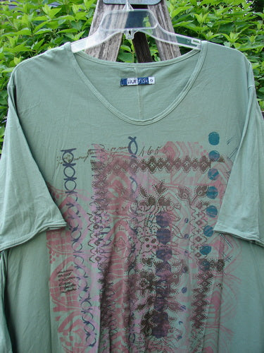 Barclay Origami Tunic Top Garden Block Spanish Moss Size 0 on a hanger, showcasing its abstract graphic print and unique hemline, emphasizing its vintage Blue Fish Clothing style.