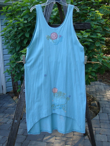 Barclay Scoop Front River Journey Dress, Fancy Floral, Blue Tourmaline, Altered Size 1, displayed on a wooden ladder.