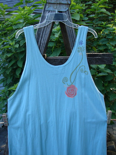 Barclay Scoop Front River Journey Dress Fancy Floral Blue Tourmaline Altered Size 1 displayed on a hanger, showcasing its deep scoop neckline, straight shape, and floral theme paint.