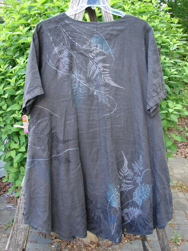 Barclay Linen Tie Pocket Cardigan Field Fern Black Size 0, displayed outdoors, features an A-line shape, short wide sleeves, and pale fern-leaf prints, highlighting its relaxed, artistic design from Bluefishfinder.com's collection.