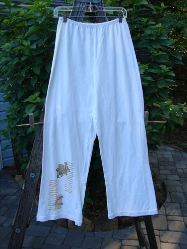 2001 Cotton Lycra Matchstick Pant Junk Drawer Fizz Size 1, featuring a slimming design with super swingy wide bottoms, displayed on a clothesline.