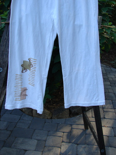 2001 Cotton Lycra Matchstick Pant Junk Drawer Fizz Size 1 featuring a thin waistband, wide bottoms, and intricate brown and tan designs, showcasing a unique, artistic style suitable for creative expression.