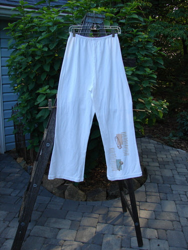 2001 Cotton Lycra Matchstick Pant Junk Drawer Fizz Size 1 displayed on a clothesline, featuring a thin waistband and wide bottoms, highlighting its pocketless, slimming design.