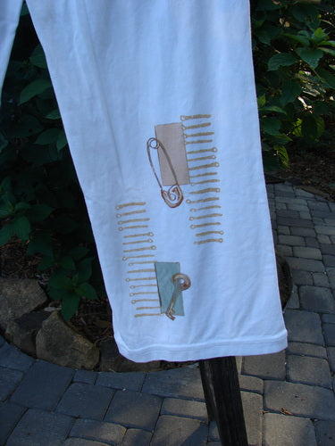 2001 Cotton Lycra Matchstick Pant Junk Drawer Fizz Size 2 displayed on a white towel with safety pins, highlighting the unique design details and wide bottoms.