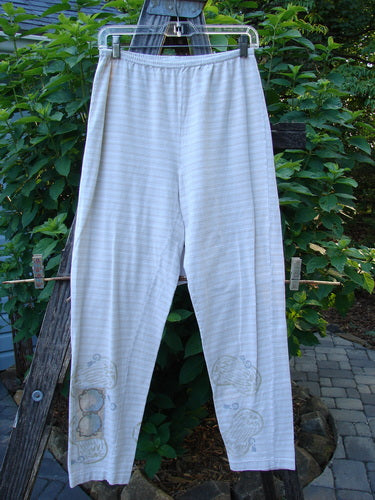 2000 Slim Pant Biology Dove Stripe Size 1, hanging on a clothesline, showcasing full elastic waistline, thin stripes, fun bottom paint, and narrowing lower legs.