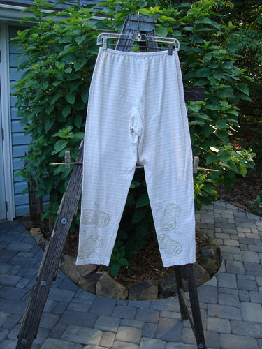 2000 Slim Pant Biology Dove Stripe Size 1 displayed on a clothes rack, showcasing its full elastic waistline, super thin stripes, and slightly longer inseam with narrowing lowers.