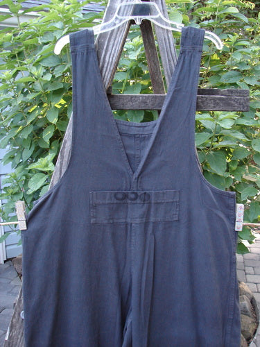2001 Patched Twill Anisette Overall Pant Jumper Licorice Size 1 displayed on a wooden fence, showcasing its unique bib pocket, sectional knee panels, and metal button closures.