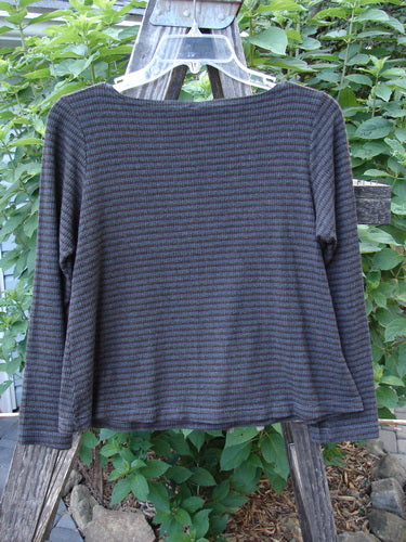 2000 Rayon Lycra Rib Long Sleeved Layering Top Unpainted Burgundy Stripe Size 1 hanging on a clothes rack, showcasing its rounded neckline and longer sleeves with a slightly cropped length.