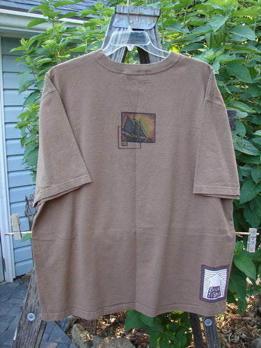 1998 Men's Short Sleeved Tee Sailboat Rock Brown Size 2 XL featuring a classic sailboat print, softly thicker ribbed neckline, and a signature Blue Fish patch in a boxier, slightly longer shape.