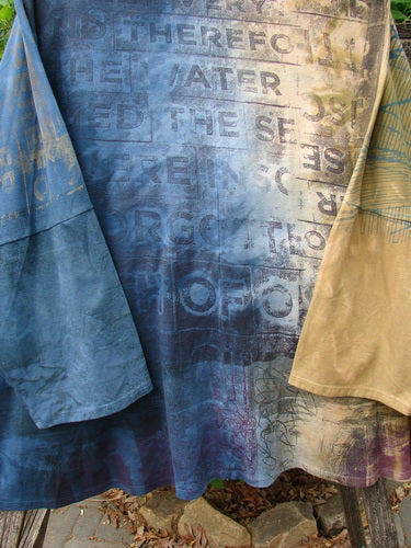 Barclay Writer's Pocket Pullover Future Night to Day OSFA displayed outdoors on a drying rack, featuring stenciled text and a seamless design, exemplifying Bluefishfinder.com's vintage-inspired creative expression.