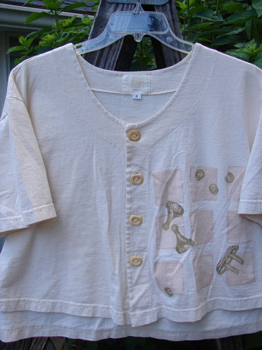 2001 Button Crop Top Pawn Natural Size 0: White crop top with a chess-themed design, vented hemline, wide short sleeves, and unique buttons.