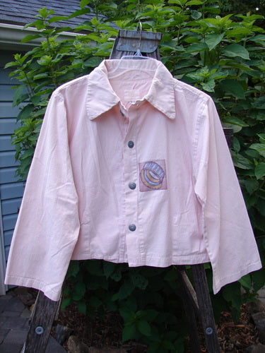 2001 Patched Licorice Jacket Pink Tile Size 0 displayed on a mannequin, highlighting its wide crop shape, metal buttons, and tailored back with vertical hem darts.
