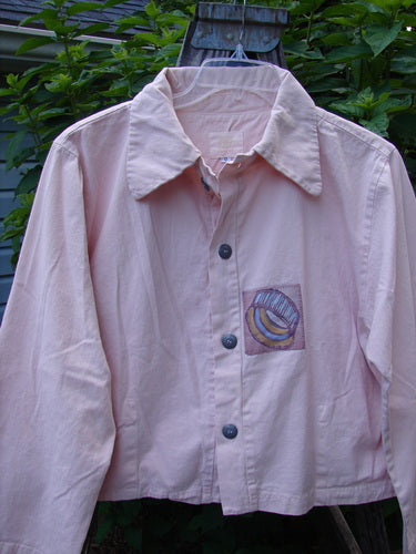 2001 Patched Licorice Jacket Pink Tile Size 0 displayed on a hanger, showcasing its 4 metal buttons, A-line shape, rounded tailored back, and small vented sides.