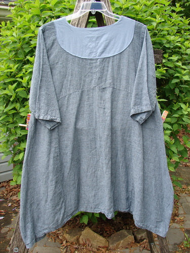 Barclay NWT Linen Cross Over Urchin Dress Unpainted Stripe Sky Size 1 features an A-line silhouette, elbow-length sleeves, and a rounded yoke, hanging against a natural outdoor backdrop.