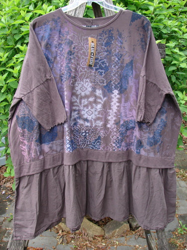 Barclay NWT Batiste Banded Flounce Esperanza Tunic Festive Garden Sparrow OSFA features boho-style, floral-tribal print panels, dropped elbow-length sleeves, and a tiered hem, hanging with BLUE FISH tag.