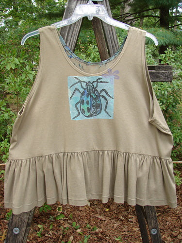1992 Peplum Top Beetle Wheat OSFA: A tan tank top featuring a hand-painted beetle design, downward yoked waist seam, wide waist, and gathered bottom flounce, exemplifying vintage Blue Fish Clothing's unique style.