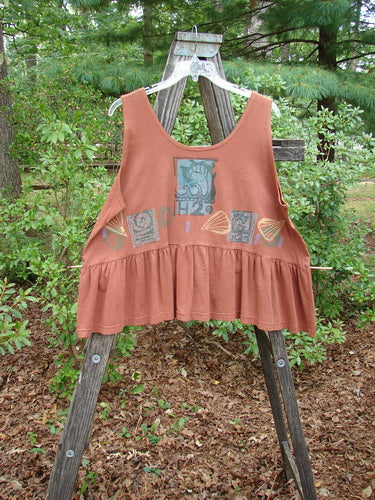 1992 Peplum Top Beach Sienna OSFA displayed on a wooden ladder, showcasing its unique graphic design and voluminous flounce bottom, part of the vintage Blue Fish Summer Collection.