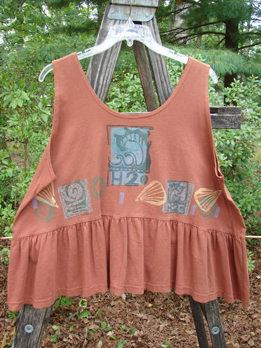 1992 Peplum Top Beach Sienna OSFA featuring a graphic design, downward yoked waist seam, rounded neckline, high arm openings, wide waist, Blue Fish patch, and gathered bottom flounce.