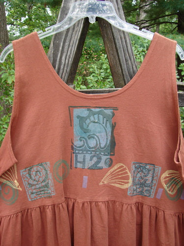 Close-up of the 1992 Peplum Top Beach Sienna OSFA, featuring a baby doll style with a downward yoked waist seam and a large gathered bottom flounce.