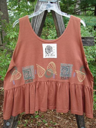 1992 Peplum Top Beach Sienna OSFA features a graphic design with a white patch and a black-and-white logo. The collectible top includes a yoked waist seam and a rounded neckline.