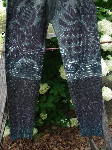 Daisy Hagey Barclay NWT Cotton Lycra Heavy Weight Legging Night Spin Boreal Size 1 in dark patterned cotton-lycra, shown hanging outdoors with leafy greenery behind it.