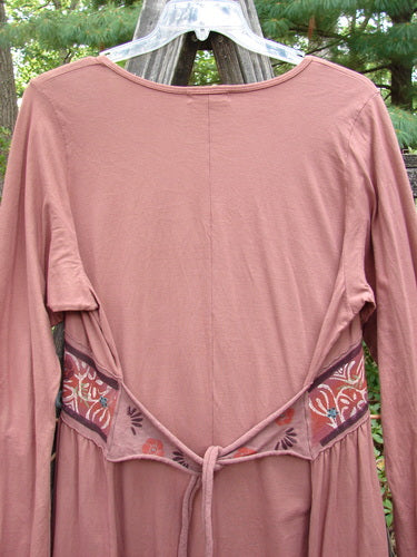 Barclay Decora Banded V Neck Dress Rouge Size 1 displayed on a swing, featuring a deep V neckline, vertical pleats, and sectional panels with gentle gathers.