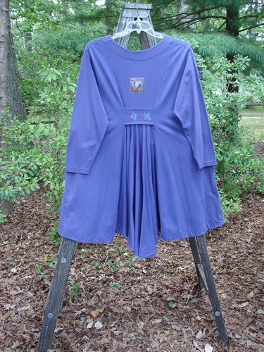 1996 Dining Car Jacket Travel Niagara Size 1 displayed on a rack, highlighting its varying hemline, deep V neckline, tabbed back accent, and artisan porcelain buttons.