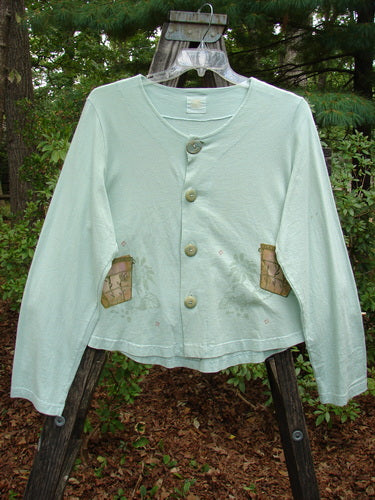 1999 Coffee Top Flowerpot Mint Size 1, featuring ceramic button closures, sweeping rounded hemline, and drawcord back, with patch details on organic cotton.