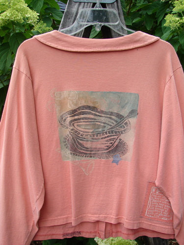 1994 Box Pocket Jacket Reef Harp Star Size 1: A pink sweatshirt featuring a unique picture on the front, medium weight cotton, full unique collar, two large front pockets, and oversized buttons, in perfect vintage condition.