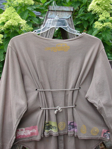 1993 Tie Back Jacket Car Bay Leaf OSFA displayed on a swinger, showcasing its unique drop shoulders, original buttons, and antique car theme paint. Perfect vintage collectible in excellent condition.