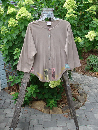 1993 Tie Back Jacket Car Bay Leaf OSFA displayed on a wooden ladder, featuring vintage buttons, drop shoulders, and a unique travel theme paint design.