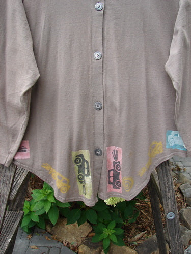 1993 Tie Back Jacket Car Bay Leaf OSFA: Close-up of a brown mid-weight cotton jacket from the 1993 Fall Collection, featuring a unique car theme design, drop shoulders, and original buttons.