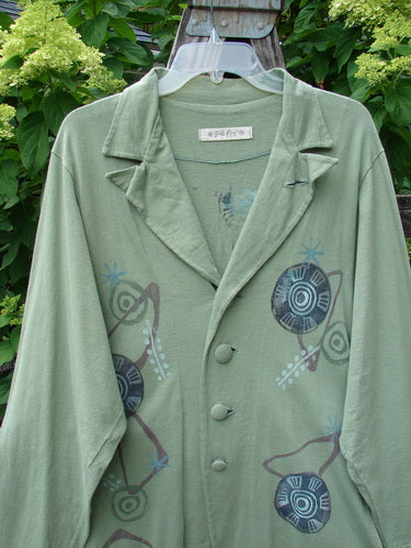 1996 Boulevard Jacket Giant Pinwheel Spanish Moss Size 0, featuring a button-accented collar, button-tabbed back, varying shirttail hem, two side pockets, and four front cloth-covered buttons.