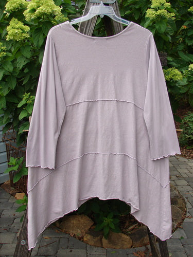Barclay Cotton Lycra Vertical Gather Drop Pocket Dress Unpainted Lavender Size 2 displayed on a hanger with long sleeves, a deeper V-shaped neckline, oversized front pockets, and sectional panels.