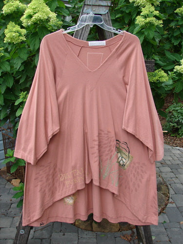 1998 Botanicals Bell Flower Top Magnolia Size 2 displayed on a swinger, featuring an A-line shape, upward scooped front hem, rounded neckline, sectional panels, and blue fish signature patch on the back.