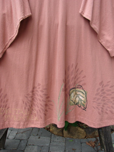 1998 Botanicals Bell Flower Top Magnolia Size 2 featuring a leaf design, belled A-line shape, upward scooped front hem, rounded neckline, sectional panels, and Blue Fish signature patch on the back.