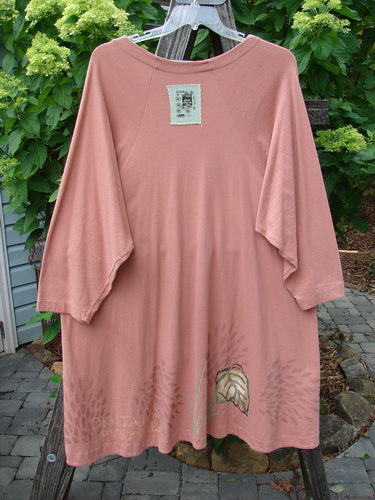 1998 Botanicals Bell Flower Top Magnolia Size 2, featuring a floral print, belled A-line shape, upward scooped hem, rounded neckline, and Blue Fish signature patch on the back.