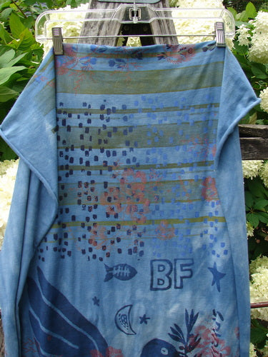 Bluefishfinder.com Barclay Scarf Wrap Belief Spirit Magic Love Dove Echo Blue OSFA, a blue scarf wrap with a soft drape and mottled, layered print. It hangs from a clip at the top, showing fish, dove, star, and BF motifs against a textured blue ground.