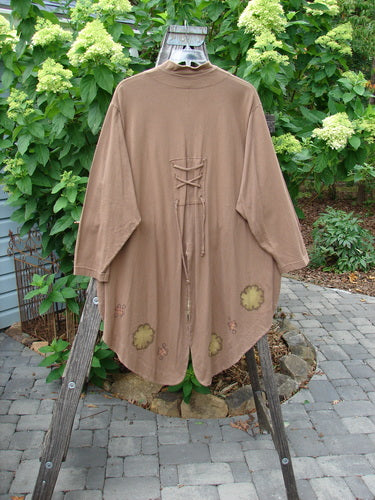 1997 Tails Jacket Day Cloud Mandorla OSFA displayed on a wooden rack, showcasing its unique tuxedo back tails, oversized brown buttons, and mandarin style mock neckline from the Holiday Winter Collection.