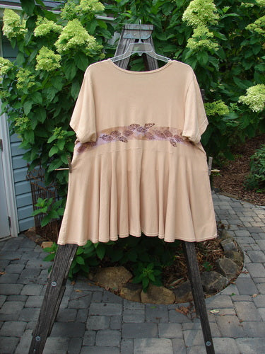 1997 Ocean Pearl Dress Leaf Band Driftwood Size 2 displayed on a hanger outside, highlighting its super summery look, rounded neckline, empire waist seam, and painted pocket with coordinating rippies.