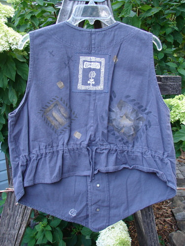 1995 Denim Invention Vest Fern Flower Madderlake Altered OSFA, featuring lightweight denim, metal buttons, varying hemline, and signature Blue Fish patch with fern and flower theme paint. Bust 44, Waist 44, Hips 44.