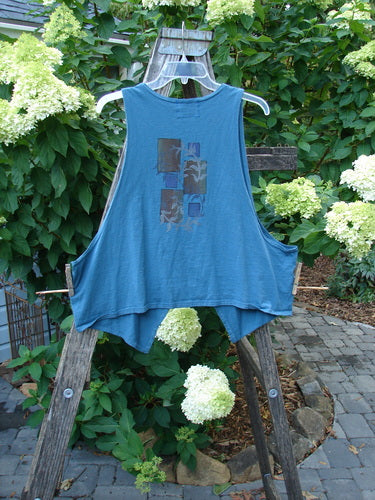 Barclay Calligrapher's Crop Vest Fern Window Blue Tealen Size 1 displayed on a clothes rack, highlighting its deep V neckline, single button closure, and dramatic front points.