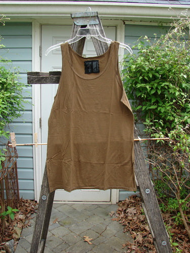 Barclay Lightweight Basic Tank Top Unpainted Bark Smaller Size 2 displayed on a wooden ladder, showcasing its straight bodice and rounded neckline, perfect for layering with vintage Blue Fish Clothing.