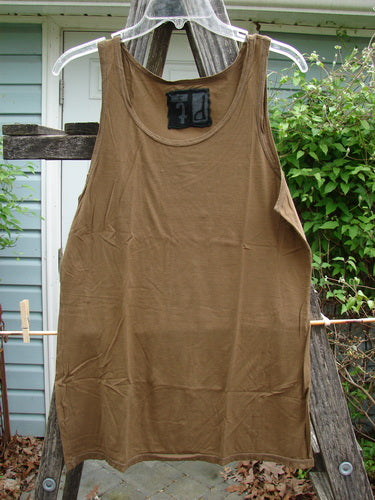 Barclay Lightweight Basic Tank Top Unpainted Bark Smaller Size 2, hanging on a clothesline, showcasing its rounded neckline and straight bodice, ideal for layering from Bluefishfinder.com’s vintage-inspired collection.