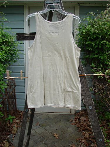 Barclay Lightweight Basic Tank Top Unpainted Pebble Smaller Size 2 displayed on a wooden ladder, showcasing its straight bodice and rounded neckline, ideal for layering from the Bluefishfinder collection.