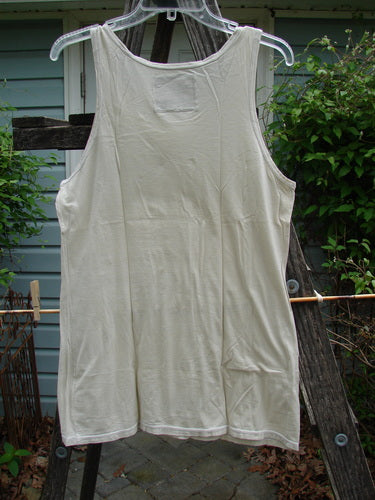 Barclay Lightweight Basic Tank Top Unpainted Pebble Smaller Size 2 hangs on a clothesline, showcasing its straight bodice and rounded neckline. Part of the Summer Collection, ideal for layering.