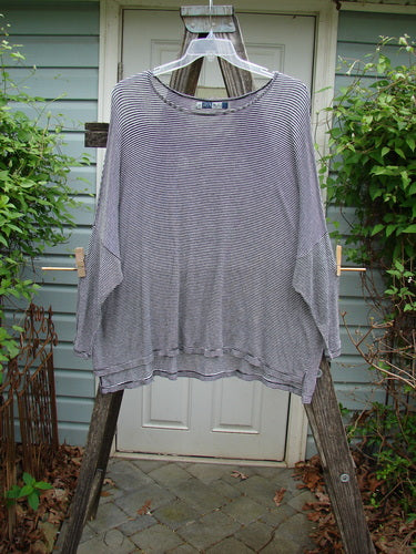 Barclay Organic Spandex Square Shirttail Top in Black White Pinstripe, displayed on hanger; features rounded neckline, boxy shape, three-quarter sleeves, and vented sides, highlighting its lightweight fabric and elegant drape.